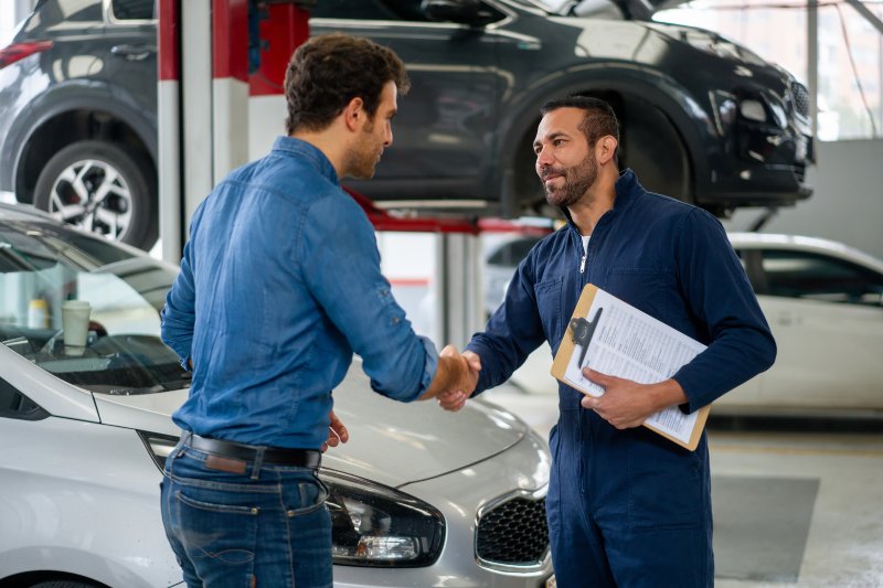 Mechanic and Customer Discussing Common Cosmetic Repairs at an Auto Repair Shop in Surrey, BC