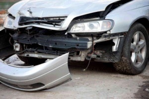 A car's bumper is ripped off in an accident in Surrey, BC